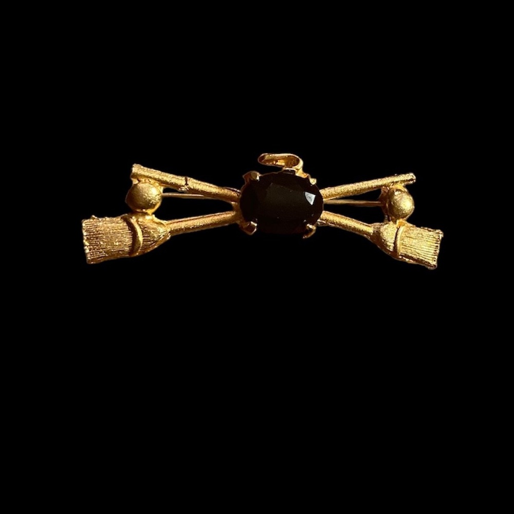 Vintage Curling Brooch Gold Toned with Crossed Brooms & a Black Rock